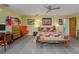 Bright primary bedroom with colorful decor, en-suite bath, and view of backyard pool at 3586 Spencer St, Las Vegas, NV 89169
