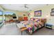 Bright primary bedroom with pool view, modern furnishings, and work space at 3586 Spencer St, Las Vegas, NV 89169