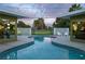 Backyard pool with a view of the golf course and surrounded by lush greenery at 3586 Spencer St, Las Vegas, NV 89169