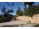 Backyard featuring gravel, landscaping, and a block wall for added privacy and a clean aesthetic at 3711 Southern Light Dr, Las Vegas, NV 89115