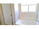 Bathroom featuring large soaking tub next to glass shower at 3883 Winter Whitetail St, Las Vegas, NV 89122