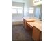 Bright bathroom features a soaking tub, double sink vanity, and large mirror at 3883 Winter Whitetail St, Las Vegas, NV 89122