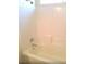 Clean, white bathtub and shower combination with tiled walls at 3883 Winter Whitetail St, Las Vegas, NV 89122