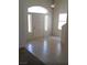 Inviting entryway featuring tile flooring, a chandelier, and natural light at 3883 Winter Whitetail St, Las Vegas, NV 89122