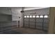 Attached garage with built in shelving and garage door at 3883 Winter Whitetail St, Las Vegas, NV 89122