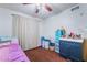 Simple bedroom with single bed, ceiling fan, and bureau with storage at 3994 Ridgewood Ave, Las Vegas, NV 89120