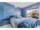 This cozy bedroom offers natural light from a large window at 3994 Ridgewood Ave, Las Vegas, NV 89120
