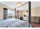 Primary bedroom with a four-poster bed, furniture and sliding glass door at 3994 Ridgewood Ave, Las Vegas, NV 89120