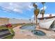 Backyard pool with spa, covered patio area, and privacy fencing at 3994 Ridgewood Ave, Las Vegas, NV 89120