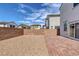 Backyard featuring a brick patio, rocks and block wall with great mountain views at 406 Misterioso St, Henderson, NV 89011