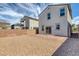 Backyard featuring a brick patio, rocks and block wall and view of the house at 406 Misterioso St, Henderson, NV 89011