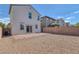 Backyard featuring a brick patio, rocks and block wall and view of the house at 406 Misterioso St, Henderson, NV 89011