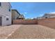 Spacious backyard features a patio, rock landscaping, and block wall perimeter at 406 Misterioso St, Henderson, NV 89011