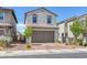 Charming stucco home with a 2 car garage, paver driveway and mature landscaping at 406 Misterioso St, Henderson, NV 89011