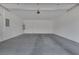 Spacious, empty two car garage with concrete floors and door to house at 406 Misterioso St, Henderson, NV 89011