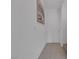 Clean hallway with neutral paint, tile flooring, and a white door at 406 Misterioso St, Henderson, NV 89011