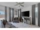Comfortable living room with contemporary decor, plush rug, and a mirrored media center at 406 Misterioso St, Henderson, NV 89011