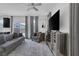 Living room with a plush rug, comfortable seating, and a modern mirrored media center at 406 Misterioso St, Henderson, NV 89011