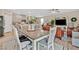 Inviting dining area with a large table, open to the kitchen and living room, perfect for gatherings at 4163 Peaceful Meadow St, Las Vegas, NV 89135