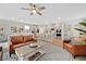 Spacious open living area featuring wood floors, a large island, and modern furnishings at 4163 Peaceful Meadow St, Las Vegas, NV 89135