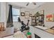 Bright office space with desk, bookshelves, and exercise equipment at 4163 Peaceful Meadow St, Las Vegas, NV 89135