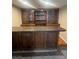 A basement featuring a bar area with extensive cabinetry and a serving counter at 4321 Mayflower Ln, Las Vegas, NV 89107