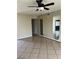 Inviting living room with tiled floors, mirrored walls, and open space for easy furniture arrangement at 4321 Mayflower Ln, Las Vegas, NV 89107