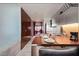 Contemporary kitchen with stainless steel appliances, dining table, and modern wallpaper, next to a wall of storage closets at 4381 W Flamingo Rd # 24304, Las Vegas, NV 89103