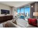 Bright living area with expansive window views, sophisticated furnishings, and chic decor at 4381 W Flamingo Rd # 24304, Las Vegas, NV 89103