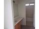 Bathroom with modern vanity and mirror, white walls and a shower-tub combo at 4732 Lone Grove Dr, Las Vegas, NV 89139