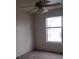A bedroom with neutral walls, carpeted floors, a ceiling fan, and a window with natural light at 4732 Lone Grove Dr, Las Vegas, NV 89139