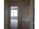 This open hallway features neutral walls, carpeted floors and access to many rooms in the house at 4732 Lone Grove Dr, Las Vegas, NV 89139
