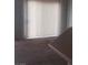 The living room features a ceiling fan, carpeted floors and lots of light from the large sliding glass doors at 4732 Lone Grove Dr, Las Vegas, NV 89139