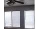 A ceiling fan is featured in the living room and natural light from the windows with blinds at 4732 Lone Grove Dr, Las Vegas, NV 89139