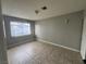 Bedroom featuring neutral paint, tiled floors and natural light from the window at 500 S 13Th St # C27, Las Vegas, NV 89101