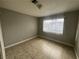 Bedroom with neutral paint, tiled floors, and natural light coming through the window at 500 S 13Th St # C27, Las Vegas, NV 89101
