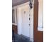 Exterior front door with decorative molding and address number 27, along with a lantern above at 500 S 13Th St # C27, Las Vegas, NV 89101