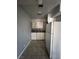 Small kitchen with white appliances, cabinets, and tiled floor at 500 S 13Th St # C27, Las Vegas, NV 89101