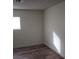 Bright bedroom featuring updated floors and natural light from window at 5126 Golden Ln # A, Las Vegas, NV 89119