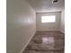This bedroom has modern, updated floors and a bright window at 5126 Golden Ln # A, Las Vegas, NV 89119