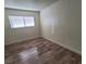Neutral bedroom featuring modern floors and a window at 5126 Golden Ln # A, Las Vegas, NV 89119