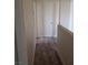 Hallway with contemporary flooring and neutral walls and trim at 5126 Golden Ln # A, Las Vegas, NV 89119