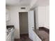 Kitchen featuring light countertops, cabinets and wood-style floors at 5126 Golden Ln # A, Las Vegas, NV 89119