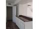 Kitchen view with bar-style countertop and wood style floors at 5126 Golden Ln # A, Las Vegas, NV 89119