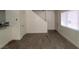 Living room view with bright, wood style floors and stairs at 5126 Golden Ln # A, Las Vegas, NV 89119