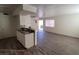 Open concept living room with kitchen bar and stairway at 5126 Golden Ln # A, Las Vegas, NV 89119