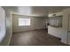 Living room featuring modern flooring, large window and interior door at 5126 Golden Ln # A, Las Vegas, NV 89119