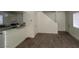 Open concept living room and kitchen area with stairway access at 5126 Golden Ln # A, Las Vegas, NV 89119