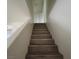 Staircase in home, leading to upper levels with neutral decor at 5126 Golden Ln # A, Las Vegas, NV 89119