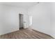 Bright bedroom with wood-style flooring, ensuite closet, and ample natural light at 5537 Sentinel Bridge St, Las Vegas, NV 89130